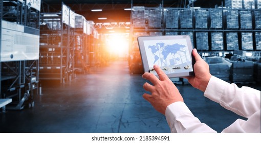 Businessman control virtual interface panel of global logistics network distribution and transportation, Smart logistics, Innovation future of transport on large warehouse center background.