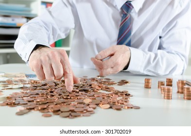 Businessman Counting Coins