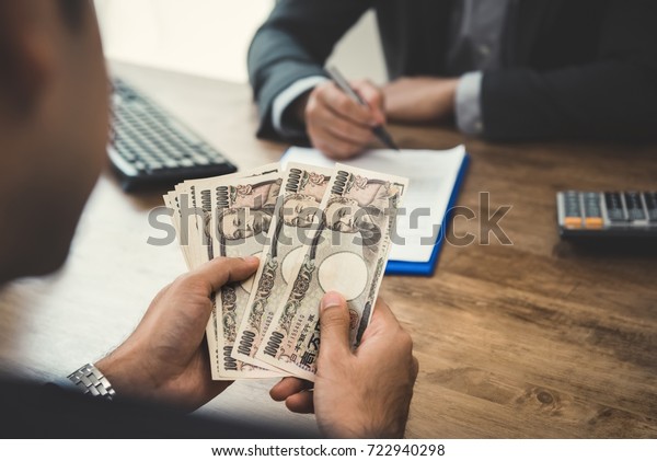 Businessman Counting Money Japanese Yen Currency Stock Photo Edit Now 722940298