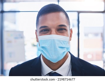 Businessman With A Covid Face Mask And Happy Portrait For Vision, Goal And Motivation For Job, Career Or Work Growth. Young Corporate Worker Working In Coronavirus Pandemic With Safety And Compliance