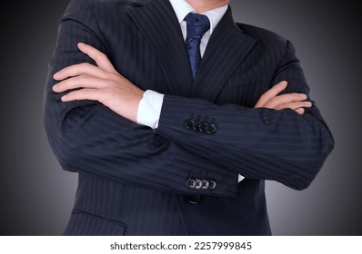 Businessman crossed arms expressing unhappy and giving pressure - Shutterstock ID 2257999845