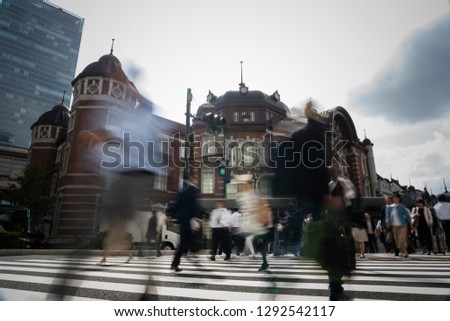 A businessman crossing an intersection
