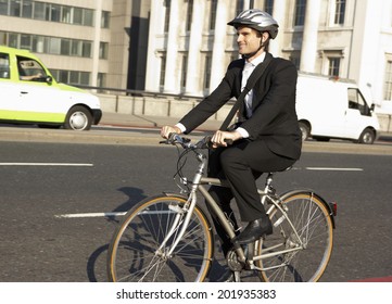 Businessman Cycling To Work