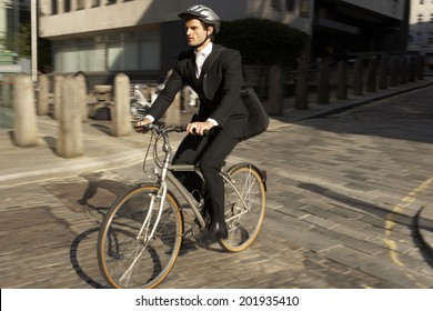 Businessman Cycling To Work