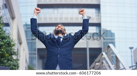 A businessman dancing in the square and is glad to have received a promotion or winning a bet. Concept: finance, business, elation, victory, wager, career, dance	