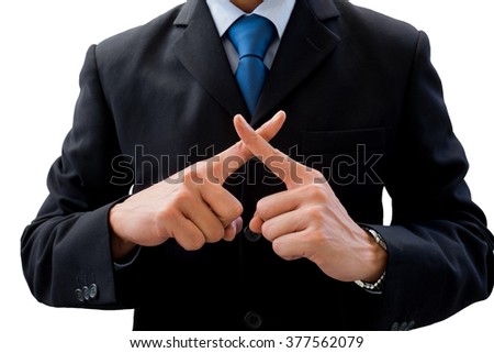 Businessman in dark gray suit using his hands as cross. Meaning wrong, fault, not correct, not allow, prohibit.