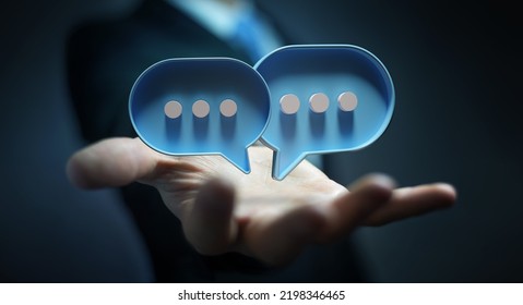 Businessman in dark using digital blue speech bubbles talk icons. Minimal conversation or social media messages floating over user hand. 3D rendering