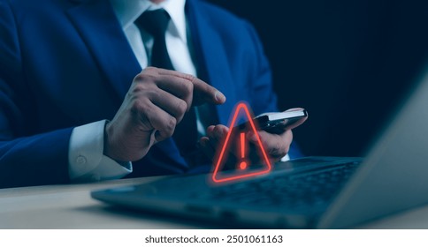 A Businessman developer working laptop computer with triangle caution warning sign for notification error and maintenance concept, network security, computer virus detected, personal data protection.
