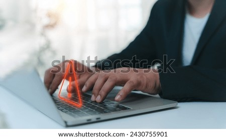 A Businessman developer working and using laptop computer with triangle caution warning sign for notification error and maintenance concept, network security, computer virus detected data protection.