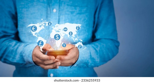 Businessman dialing the phone to make an international money transfer. International money transfer and exchange concept. and online interbank payments. - Shutterstock ID 2336255933