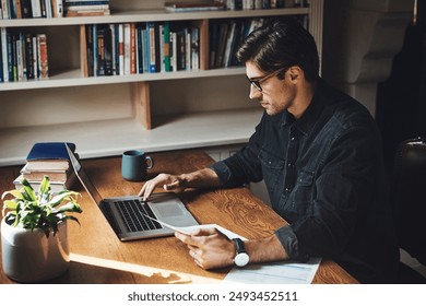 Businessman, documents and typing on laptop in home office with client mortgage application or taxes review. Lawyer, expert and remote work with paperwork for savings analysis and property agreement - Powered by Shutterstock