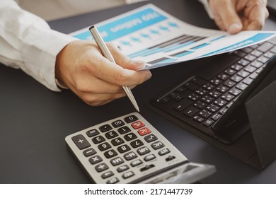 Businessman doing finances and calculate about cost to investment , business Financing Accounting Banking Concept, tax system - Shutterstock ID 2171447739