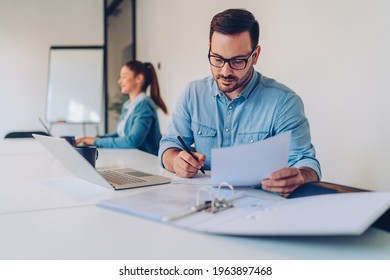 Businessman Doing Paperwork In The Office