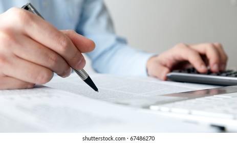 Businessman Doing Some Paperwork In His Office