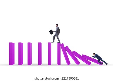 Businessman In Domino Effect Concept