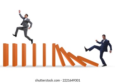 Businessman In Domino Effect Concept