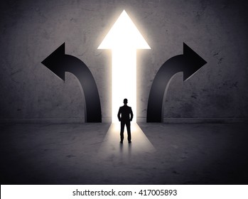 A businessman in doubt, having to choose between three different choices indicated by arrows pointing in opposite direction concept - Shutterstock ID 417005893