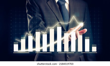 Businessman draw finance allusive graph chart showing business profit growth increasing to future target . Excellent financial status of corporate business rise up . Finance and money technology . - Shutterstock ID 2184519703