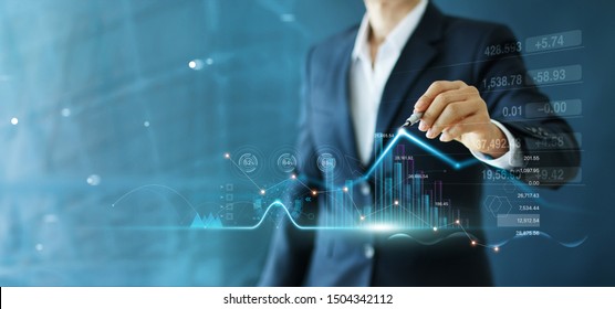 Businessman draw growth graph and progress of business and analyzing financial and investment data ,business planning and strategy on blue background. - Shutterstock ID 1504342112