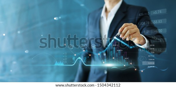 Businessman draw growth graph and progress of
business and analyzing financial and investment data ,business
planning and strategy on blue
background.