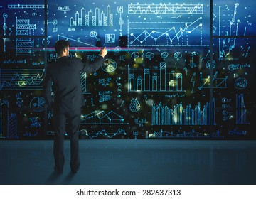 Businessman Drawing Business Statistics On Glass Stock Photo 282637313 ...