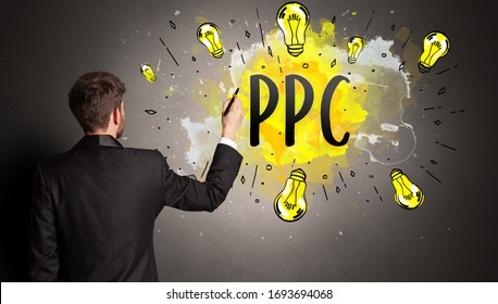 businessman drawing colorful light bulb with PPC abbreviation, new technology idea concept