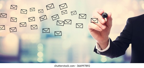 Businessman drawing E-mails concept on blurred abstract background  - Shutterstock ID 366997892