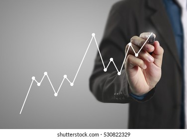 Businessman Drawing Graphics A Growing Graph