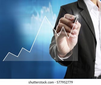 Businessman Drawing Graphics A Growing Graph