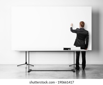 Businessman Drawing On Flip Chart