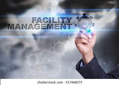 Businessman Is Drawing On Virtual Screen. Facility Management Concept