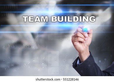 Businessman Is Drawing On Virtual Screen. Team Building Concept.