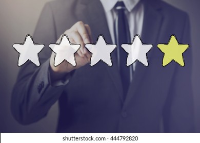 Businessman drawing one star in the air - indicates disatisfaction, unhappy, bad performance in service and product