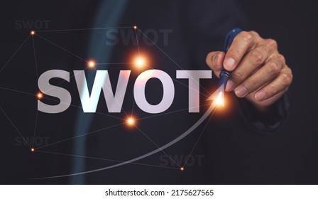 businessman drawing swot analysis strategy for business plan and growth