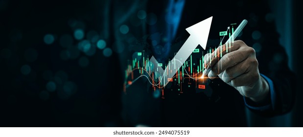 Businessman Drawing Upward Arrow on Digital Stock Market Graph with Trading Data, Buy and Sell Indicators, Representing Financial Growth, Investment Success Foreign currency trading and Forex Trading - Powered by Shutterstock