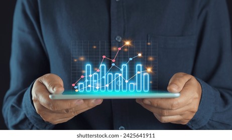 Businessman drawing virtual technical graph and chart for analysis stock market, technology investment and value investment concept.
