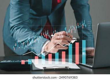 Businessman drawing virtual technical graph and chart for analysis stock market, technology investment and value investment concept. - Powered by Shutterstock