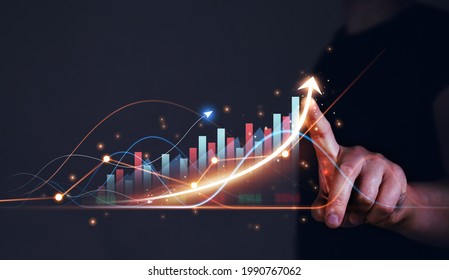 Businessman drawings growth graph of business. Business strategy development and growing growth plan. - Shutterstock ID 1990767062
