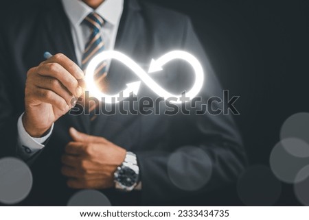 Businessman draws focus to infinity symbol, representing unlimited connection in data technology. Cyber space, future unlimited. Infinite power, energy, internet information. technology infinity data