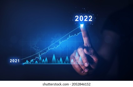 Businessman Draws  Increase Arrow Graph Corporate Future Growth Year 2021 To 2022.   Planning,opportunity, Challenge And Business Strategy. New Goals, Plans And Visions For Next Year 2022.