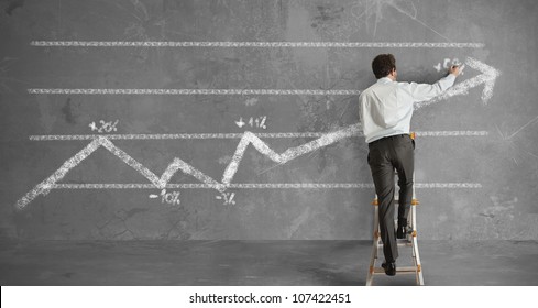 Businessman draws a statistical trend line