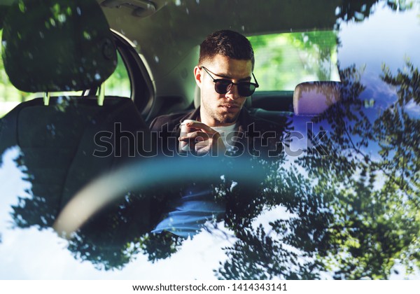 Businessman Drinking Coffee In\
Car