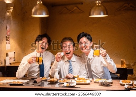 A businessman drinking at a pub while rubbing shoulders with his boss