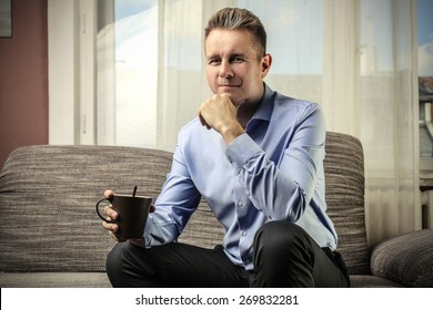 Businessman drinking a tea  - Shutterstock ID 269832281