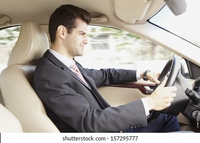 Businessman Driving A Car