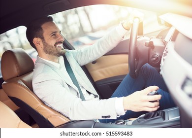 Businessman driving a car. - Shutterstock ID 515593483