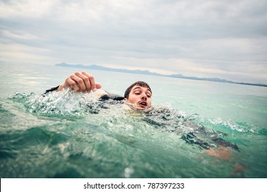 Businessman Drowning in the Sea