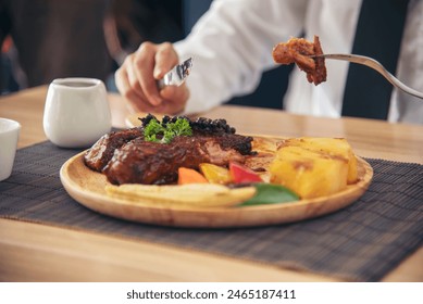 Businessman eat Steak having lunch at a restaurant. Ribs eye steak with mashed potato, salad cream French fries Barbecue Grill and Spaghetti, Happy man sitting have dinner enjoying food - Powered by Shutterstock