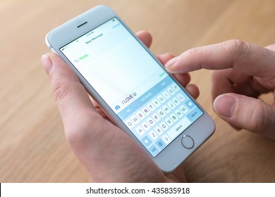 businessman edits message on mobile phone 