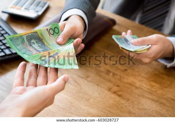 Businessman Employer Paying Cash Australian Dollar Stock